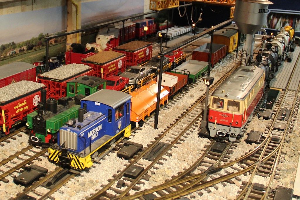 20 sidings can be isolated so the layout could accommodate more than the current 10 locomotives. Each section is controlled by lights and most have remote uncouplers. Everything is controlled by the control boxes.