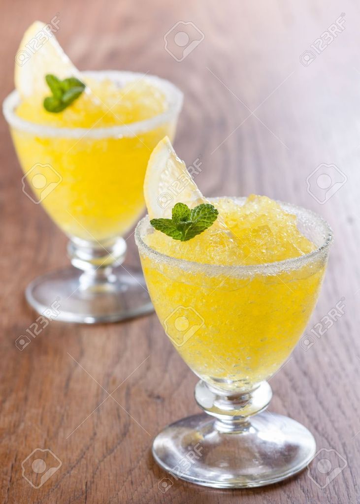 18161549-Lemon-slushie-cups-decorated-with-mint-on-wooden-table-Stock-Photo_zpsrio4xzzd.jpg